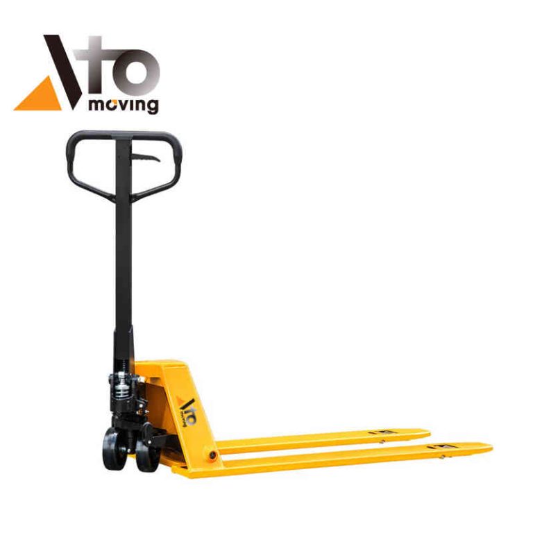 Bright yellow low profile pallet jack with black handle, designed for sliding under and lifting low-clearance pallets in a warehouse