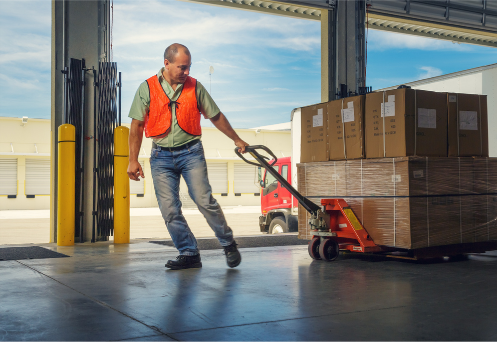 Heavy-duty hydraulic pallet jack moving wooden pallet