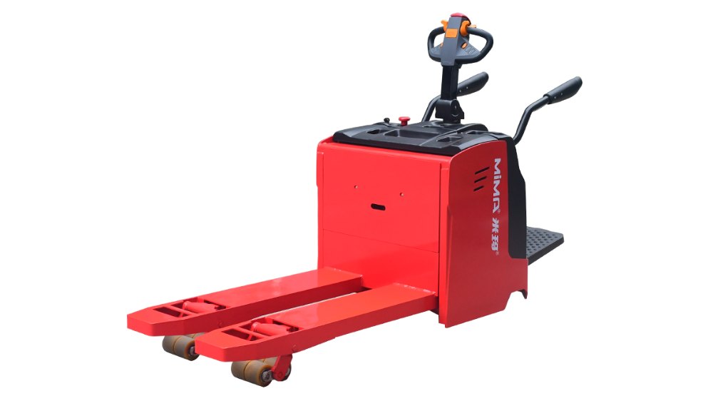 Heavy-duty red MIMA electric pallet truck with a stand-on operator platform and ergonomic multi-function control handle. Designed for efficient bulk material handling in large warehouses and distribution centers.